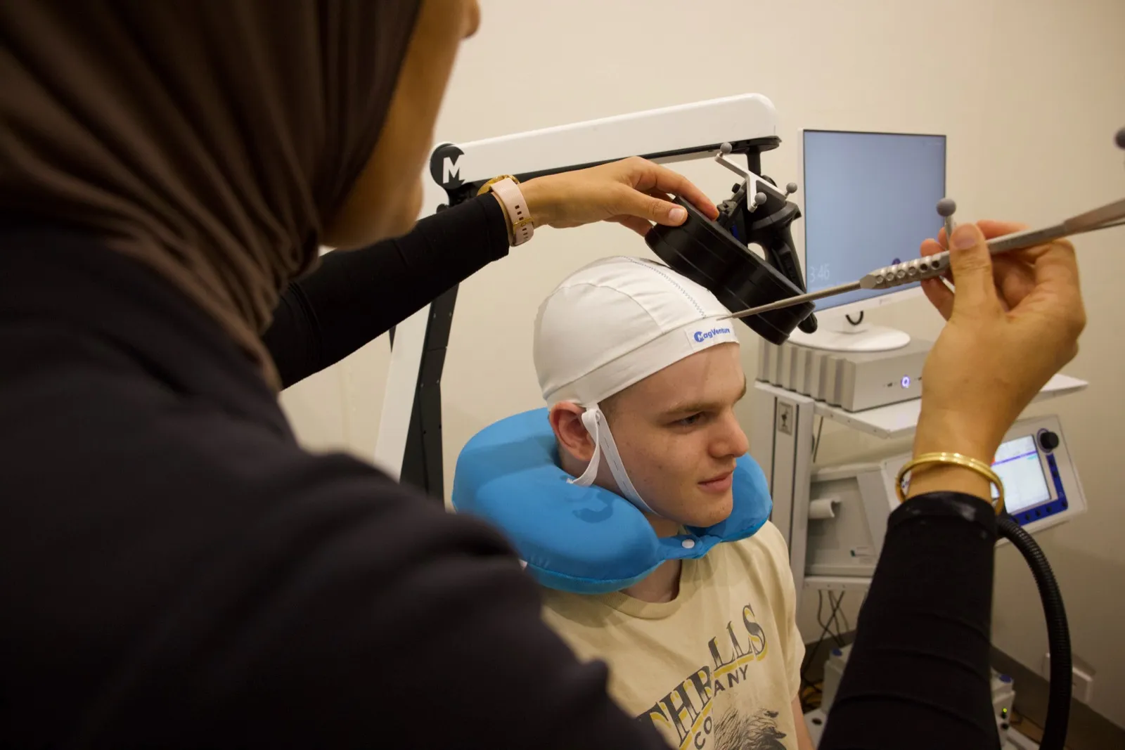 A patient receiving precision, tech-enhanced TMS care