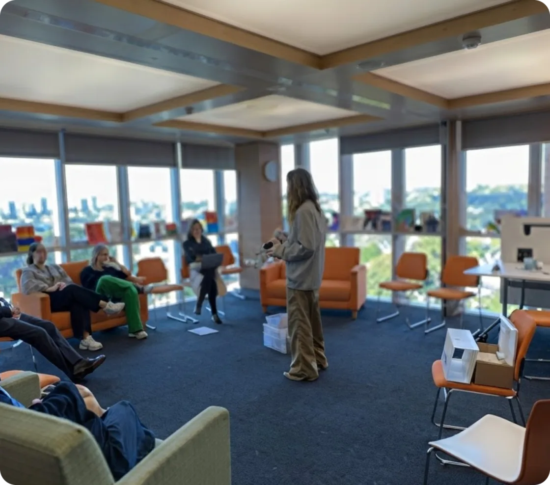 Group education session in a light-filled room overlooking the city