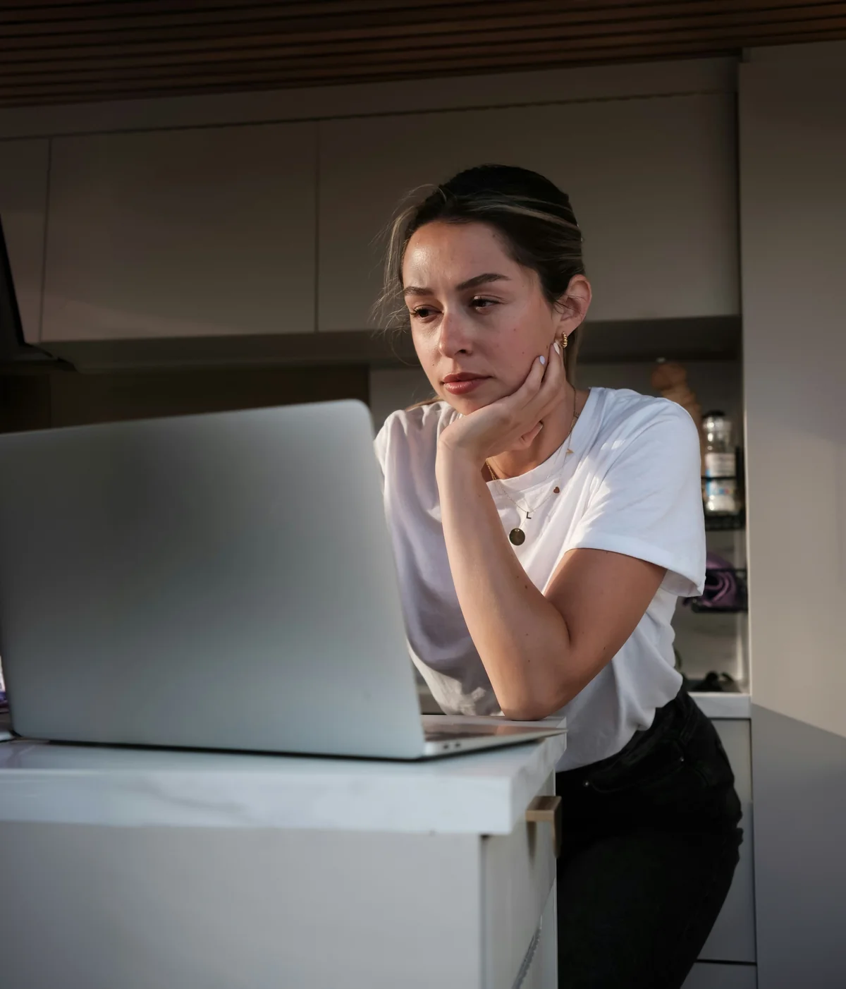 A clinician reviewing digital mental health services on a laptop