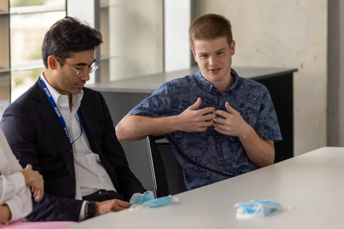 A clinician guiding a young help-seeker through the platform